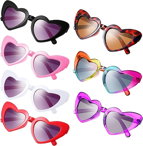 Kids wearing heart-shaped sunglasses in various colors