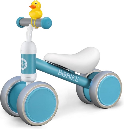 Toddler confidently riding balance bike outdoors