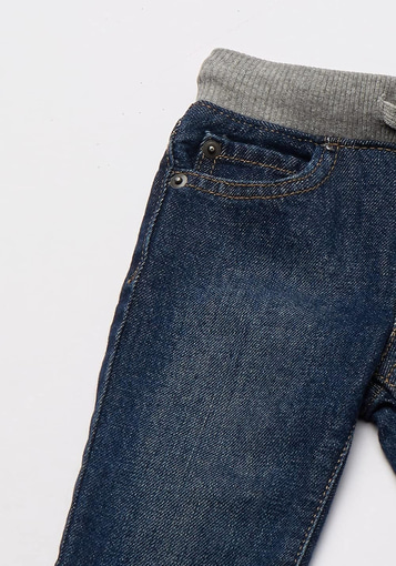 A boy baby or toddler wearing pull-on straight jeans