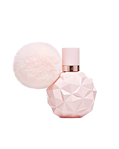 Close-up of Sweet Like Candy perfume bottle, highlighting pink design and playful details.
