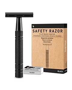 Matte black safety razor with open head and blade.