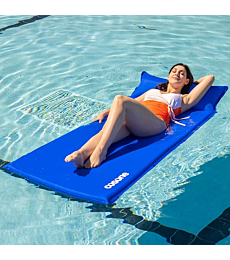 Adult relaxing on a self-inflating pool float in a pool.
