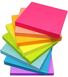 Bright colored 3x3 sticky notes on a desk