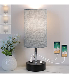 Modern bedside lamp with fabric shade, providing warm white light.
