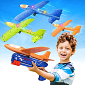 A set of three colorful LED foam glider airplanes with a launcher for kids aged 4 to 12