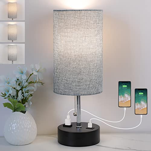 Modern bedside lamp with fabric shade, providing warm white light.
