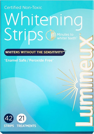 Applying Lumineux Teeth Whitening Strips for a whiter smile. - Anti allergy Teeth Whitening Strips
