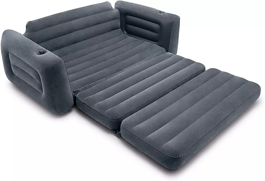 Gray inflatable sofa bed in living room setting.