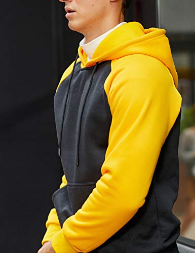Model wearing a comfortable heather grey Men's Pullover Hoodie.