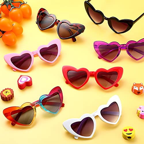 Kids wearing heart-shaped sunglasses in various colors