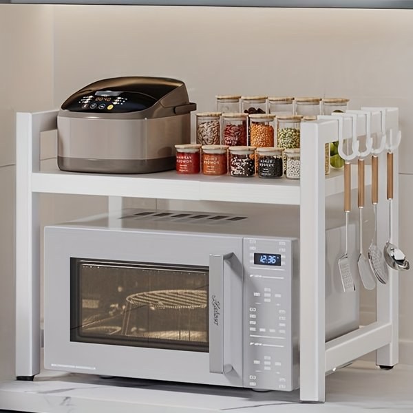 Expandable 2-tier kitchen storage rack with microwave shelf and open countertop organizer for cookware, spices, and kitchen accessories