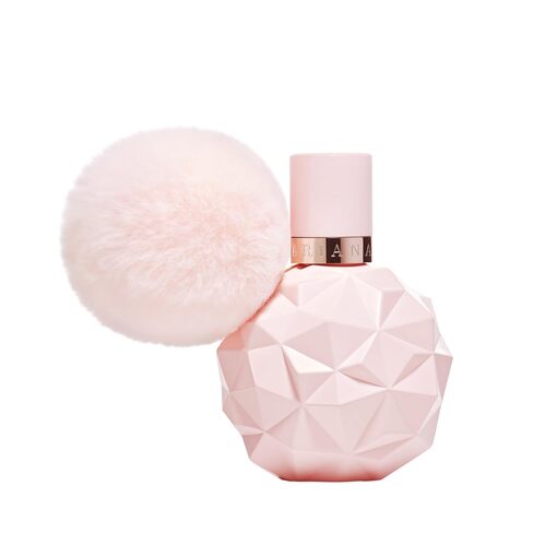 Close-up of Sweet Like Candy perfume bottle, highlighting pink design and playful details.
