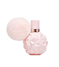 Close-up of Sweet Like Candy perfume bottle, highlighting pink design and playful details.
