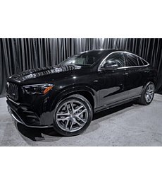 A black 2024 Mercedes-Benz GLE AMG 53 Coupe SUV with 10 miles on the odometer and AMG enhancements
