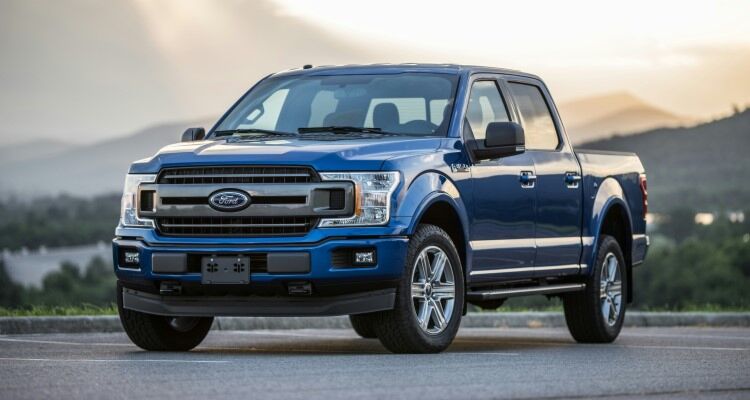 A blue 2023 Ford F-150 Pickup Truck Parked on Road