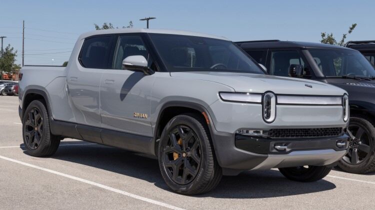 Rivian R1T electric pickup truck parked in a parking lot